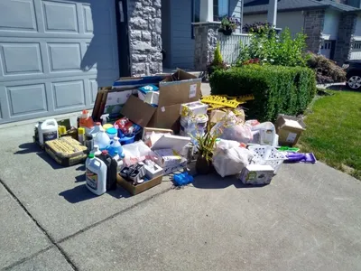 Curbside pile of household boxes and clutter for pickup