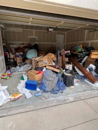 Two-car garage packed floor to ceiling before cleanout
